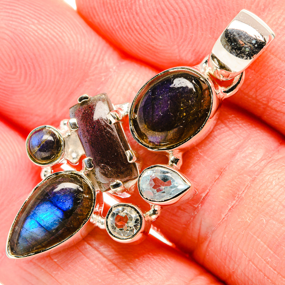 Sterling silver gemstone pendant with oval blue and purple labradorite, clear accents