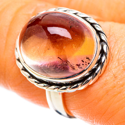 Sterling silver oval ametrine cabochon ring with braided rope-style bezel