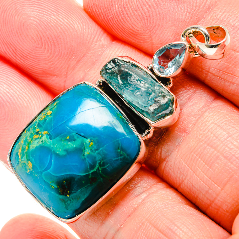 Close-up sterling silver pendant with blue square stone, green cabochon, top loop bail