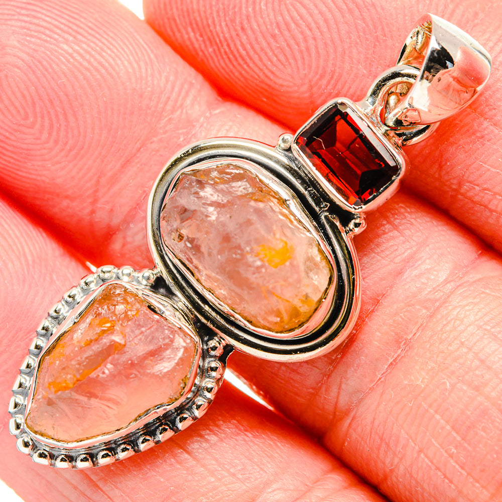 925 sterling silver pendant close-up with rough rose quartz and red garnet accents