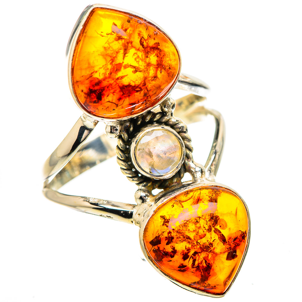 Sterling silver ring with two amber teardrop stones and a round iridescent moonstone