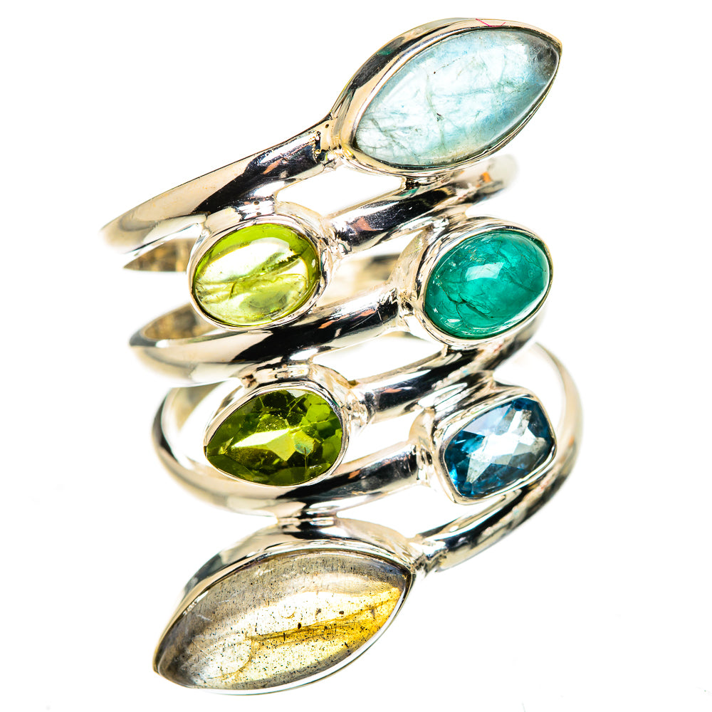Silver statement ring featuring oval green, blue, and gray gemstones in bezel/prong settings