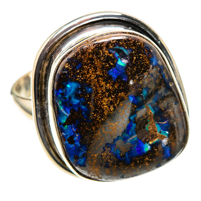 Sterling silver ring with oval boulder opal, blue flashes and coppery matrix bezel