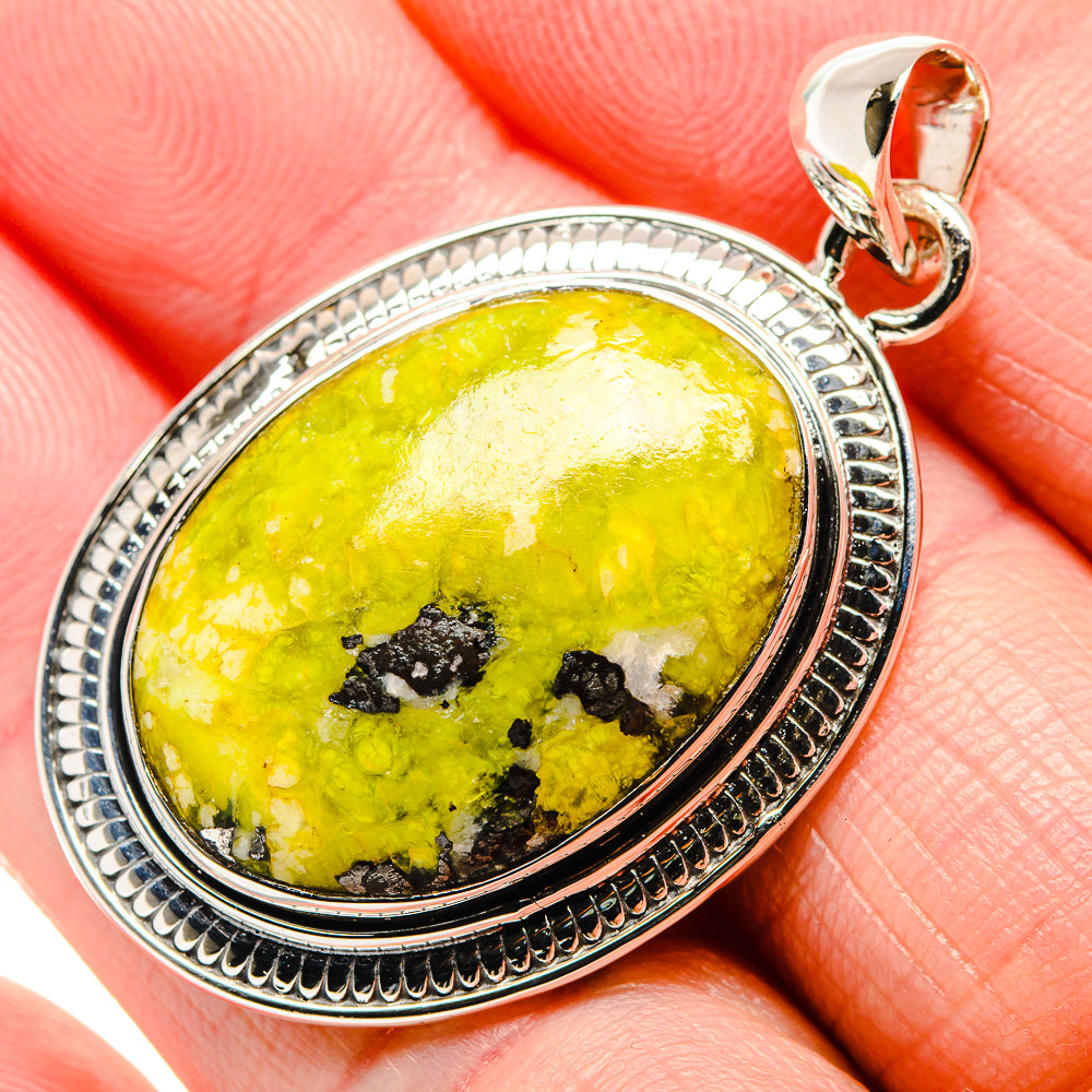 Sterling silver lemon jasper oval pendant with textured bezel and bail, yellow stone