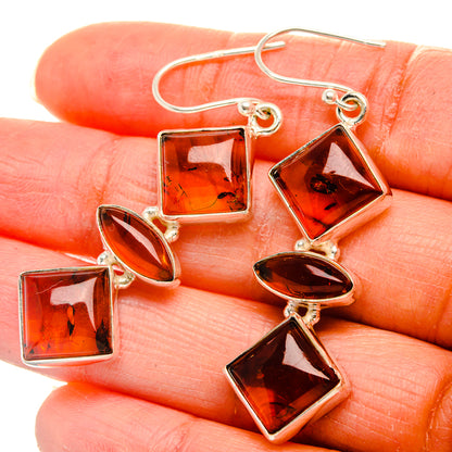 Baltic amber earrings close-up with square and diamond amber stones on sterling hooks