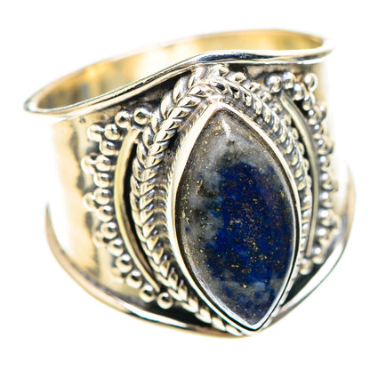 Sterling silver ring with oval lapis lazuli cabochon and ornate filigree bezel