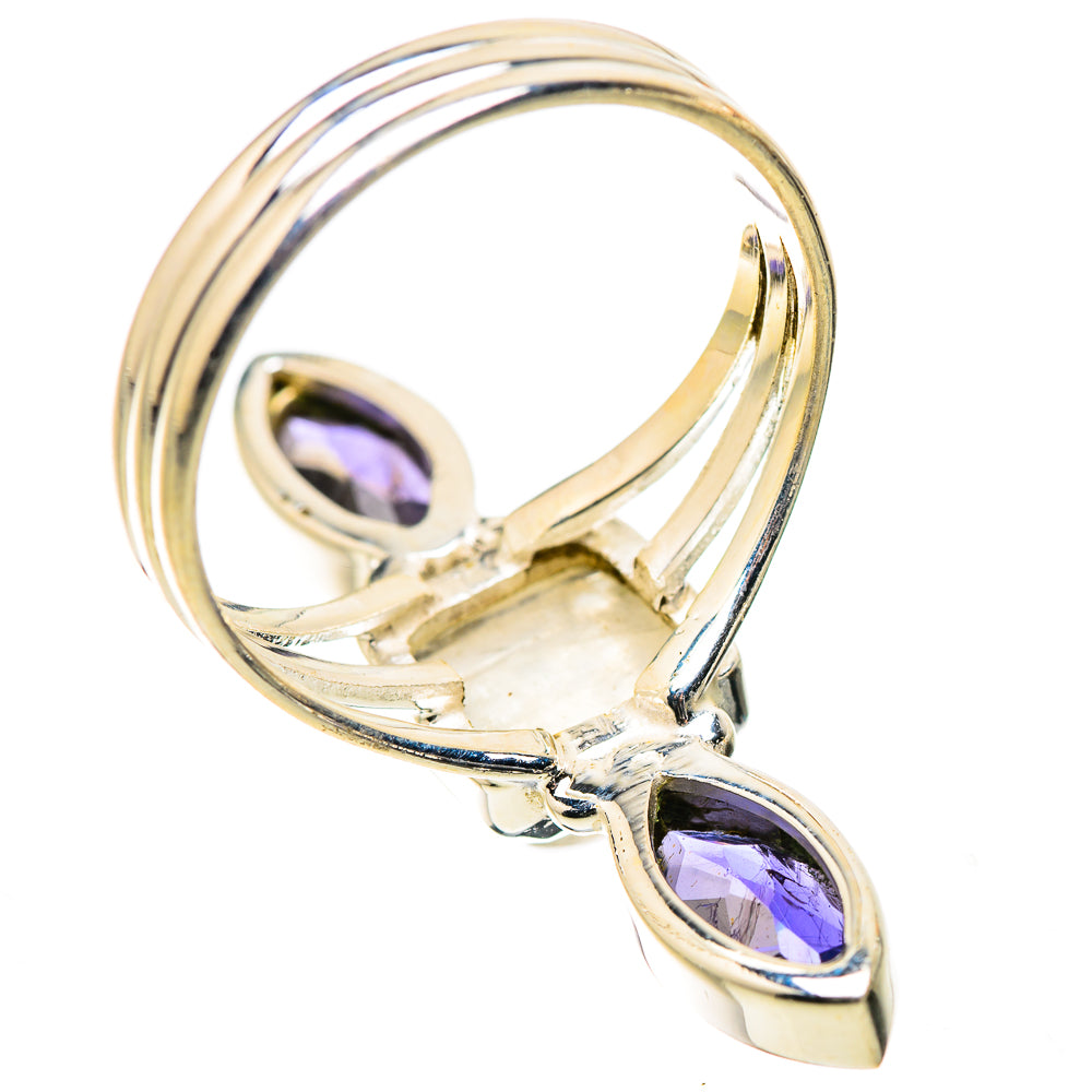 Sterling silver ring with oval purple gemstones and raised moonstone center, side view