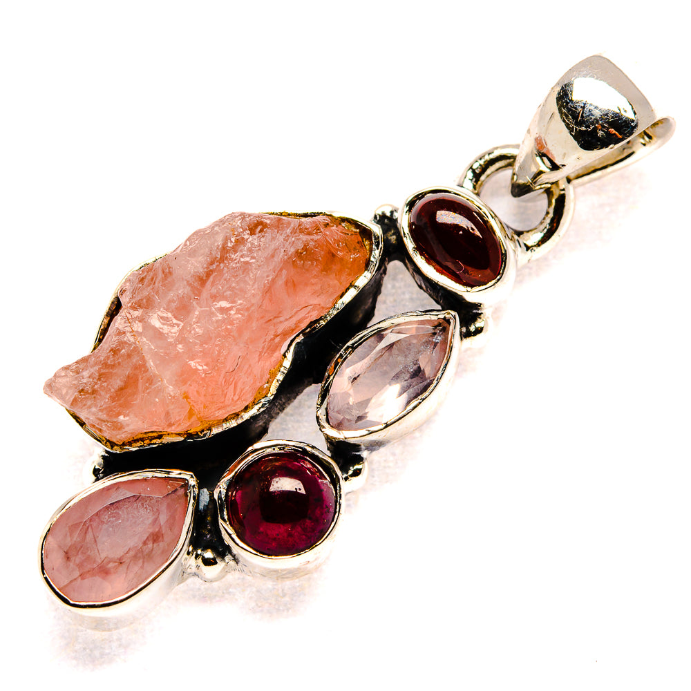 Sterling silver pendant with rough rose quartz stones and red garnet teardrop accents