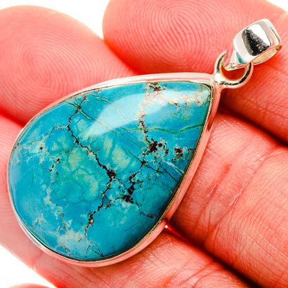 Teardrop turquoise pendant with sterling silver border and small loop bail.