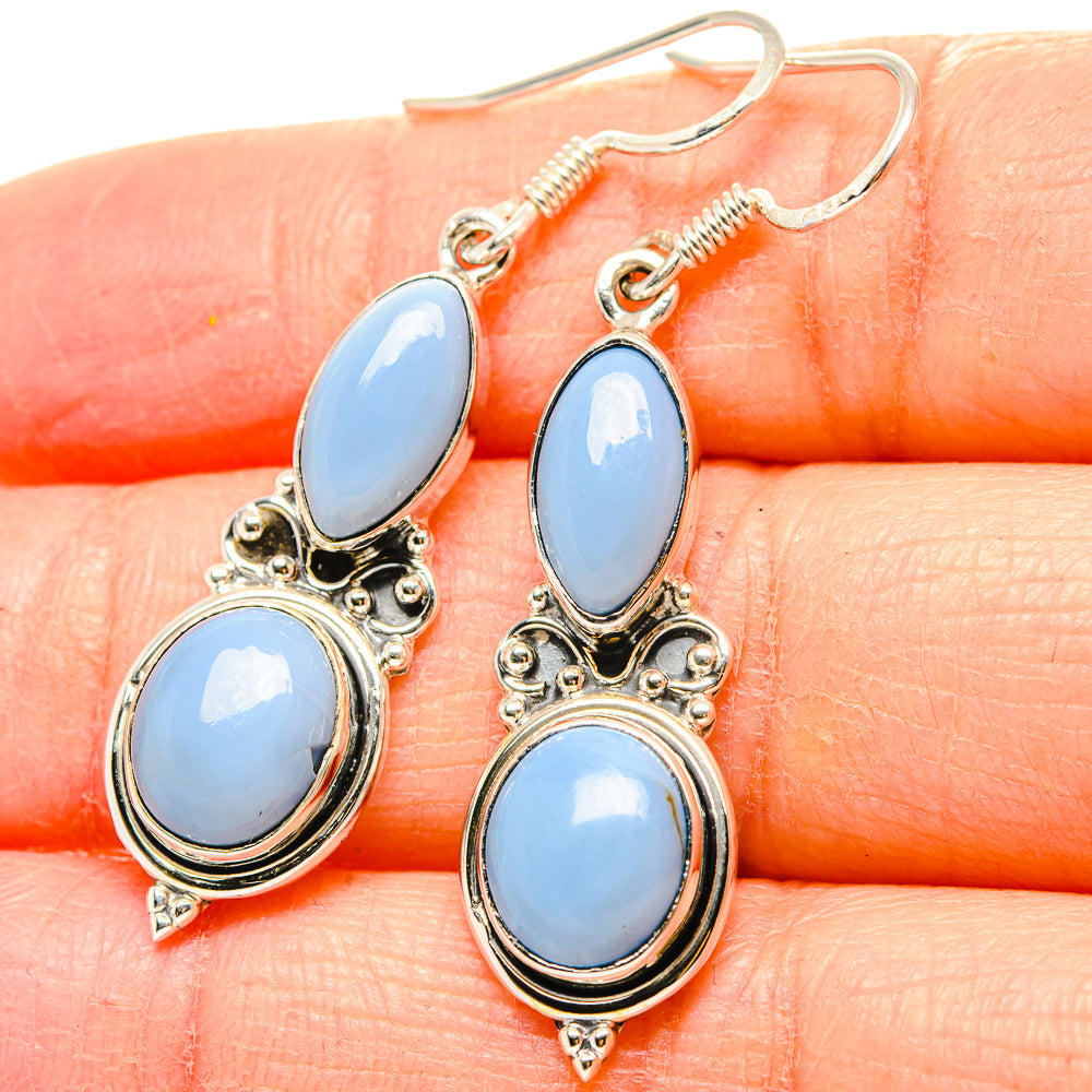 925 sterling silver opal drop earrings, three light-blue oval stones in ornate frames.