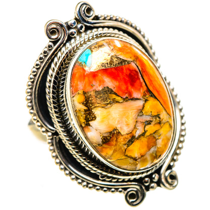 Sterling silver oval gemstone ring with turquoise flecks, fiery orange and yellow pattern