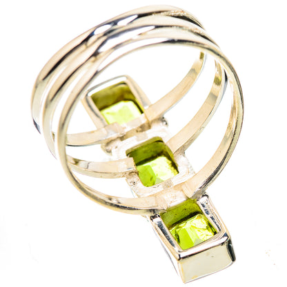 Sterling silver ring with three square green peridot gemstones and twisted band