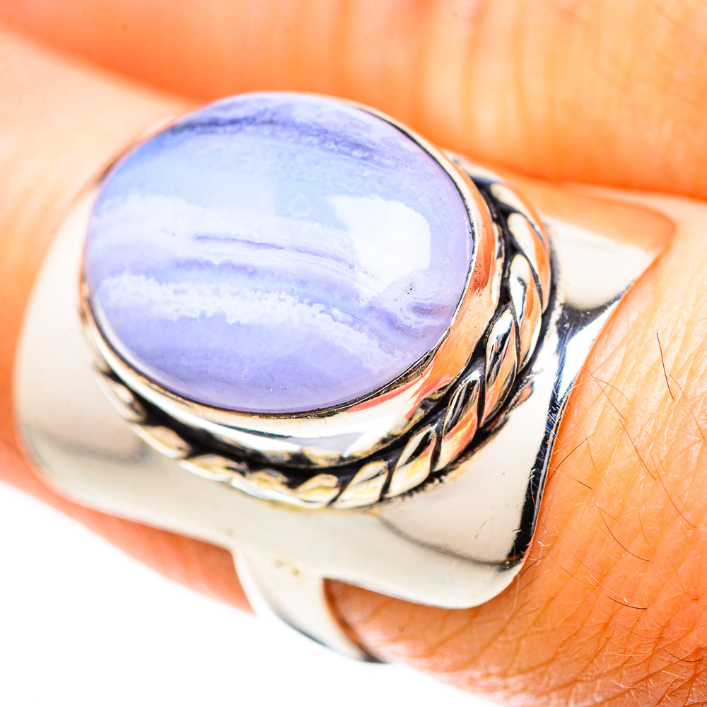 Sterling silver ring with oval blue lace agate cabochon and braided bezel detail
