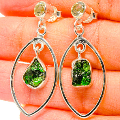 Sterling silver dangle earrings with rough green gemstone drops in oval hoops