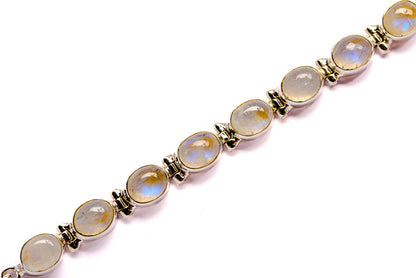 Sterling silver bracelet featuring oval rainbow moonstones in gold-tone bezels
