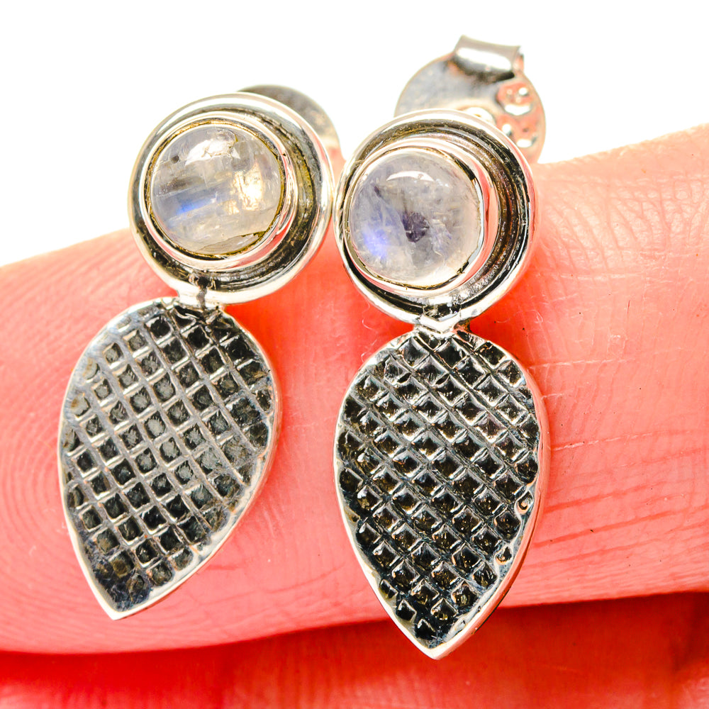 Sterling silver moonstone earrings with round stones and black textured teardrop dangles