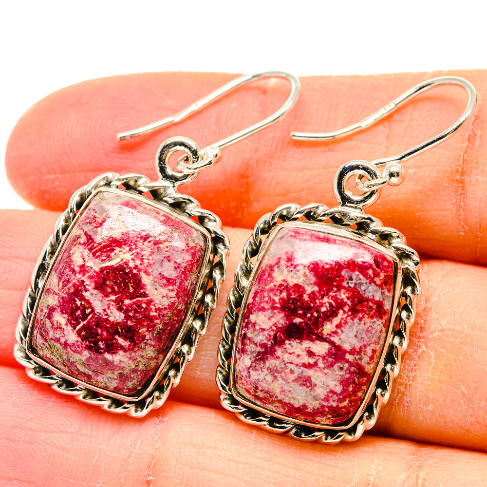 Thulite earrings in square silver bezel with pink-red stone, scalloped frame, fishhook