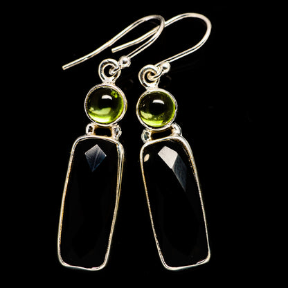 Sterling silver dangling earrings with round green stones and black onyx drops