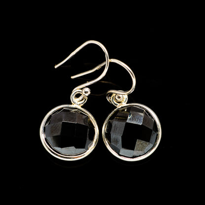 Sterling silver hoop earrings with round faceted black onyx dangles
