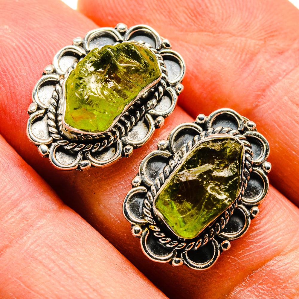 Rough green peridot stud earrings with ornate 925 sterling silver scalloped border