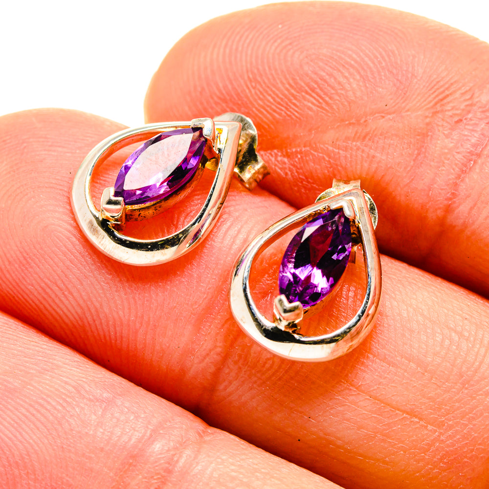 Amethyst drop earrings, 925 sterling silver with faceted purple teardrop stones on close view