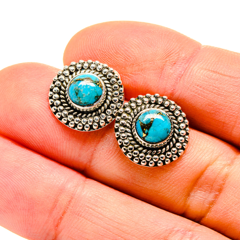 Turquoise cabochon earrings with beaded silver border and circular gold-tone backing