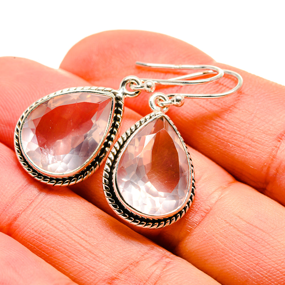 Teardrop rose quartz earrings in silver with ornate bezel and hook backs