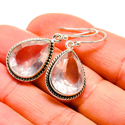 Teardrop rose quartz earrings in silver with ornate bezel and hook backs