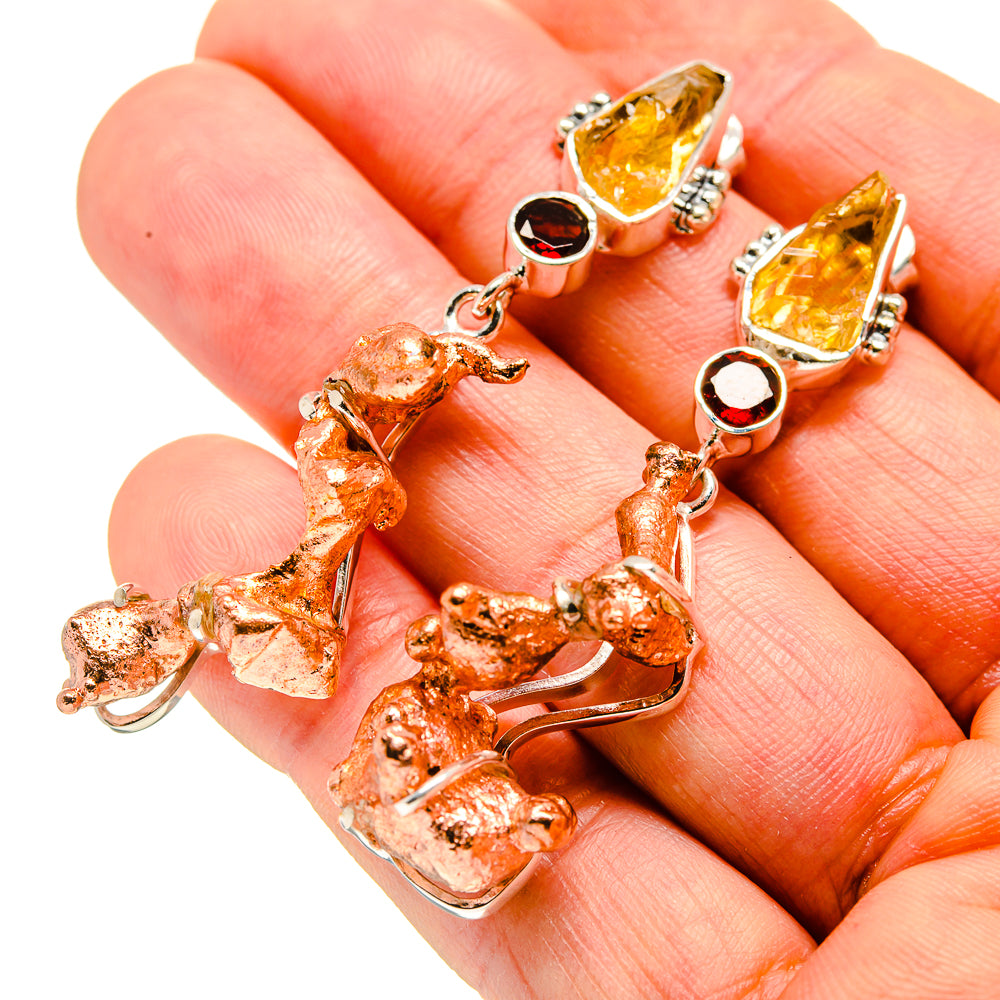 Copper-textured drop earrings with yellow top stones and dark red accents, 925 silver