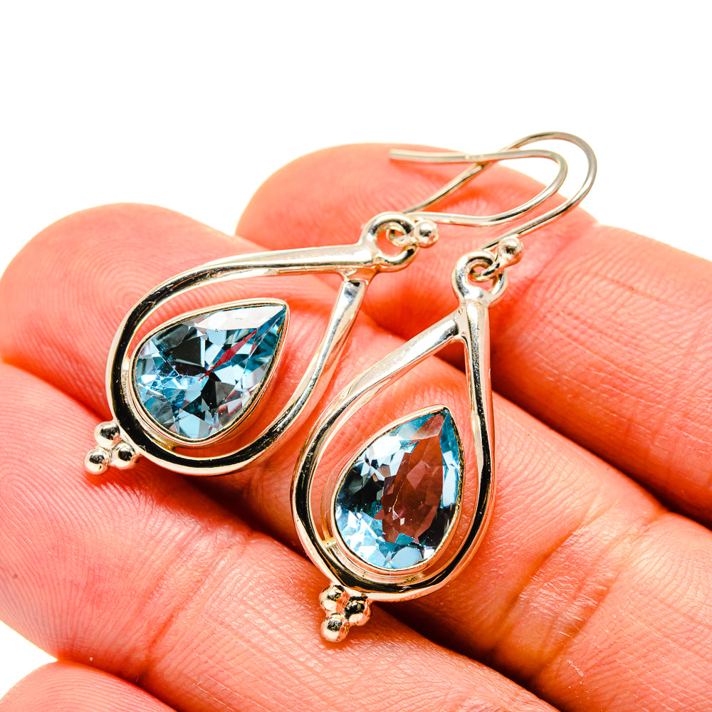 Blue topaz teardrop earrings with hinged loop hooks, 925 sterling silver, close-up