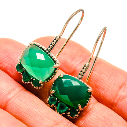 Green onyx drop earrings with gold-tone hooks and emerald-green gemstones, bead accents
