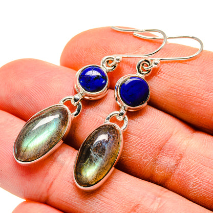 Sterling silver earrings with round blue stones and two iridescent teardrop drops