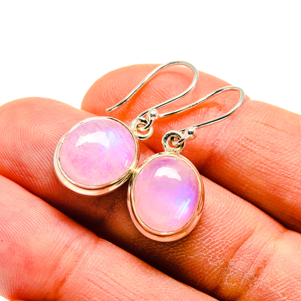 Pink moonstone drop earrings on sterling silver hooks, gold-tone teardrop cabochons