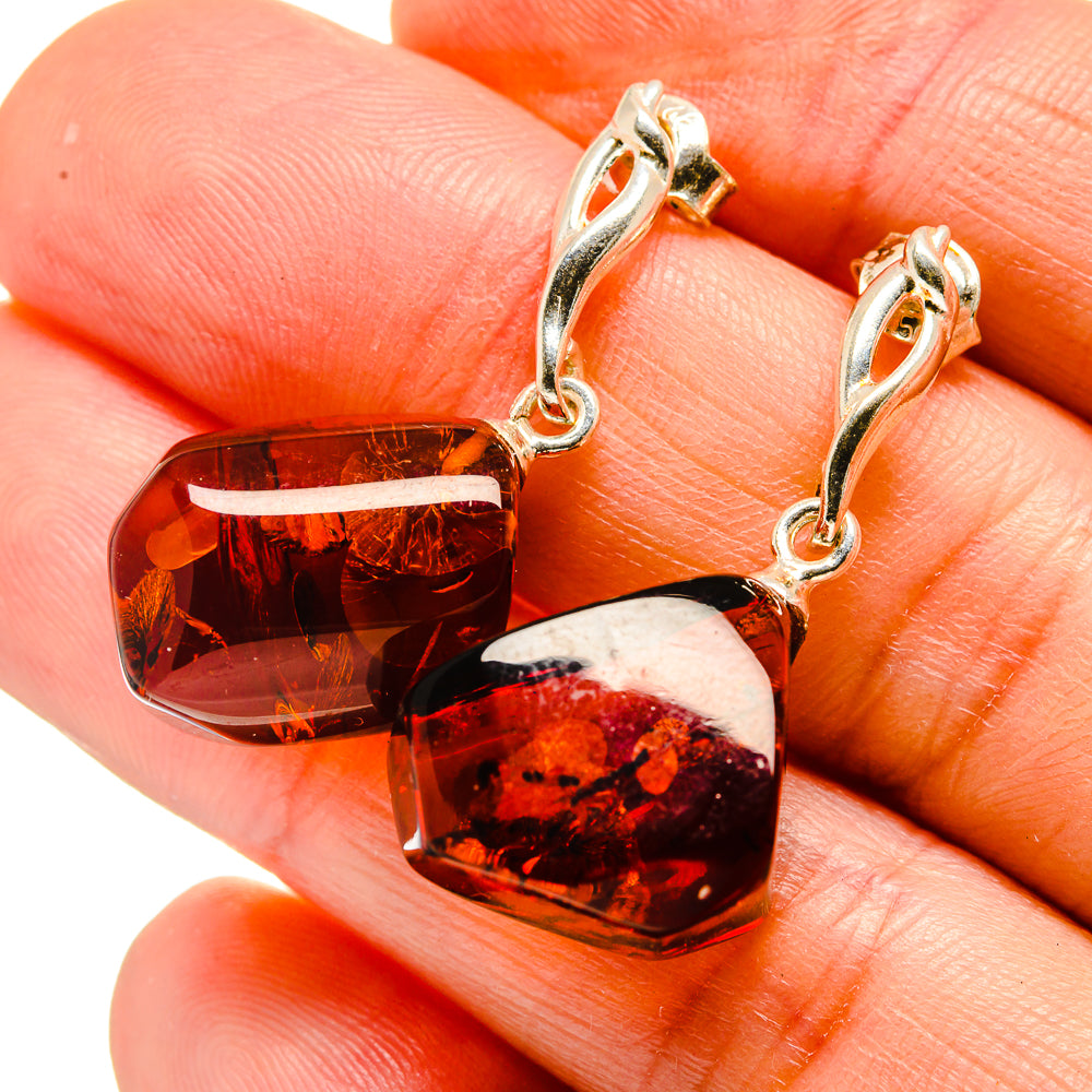 Sterling silver amber heart drop earrings with small hoops and dark cognac stones