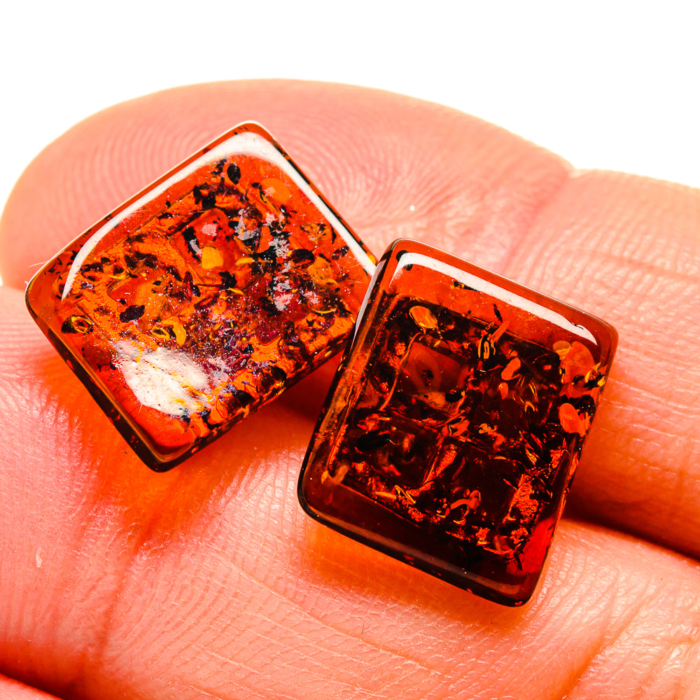 Square Baltic amber stud earrings in 925 sterling silver bezels, dark orange with flecks