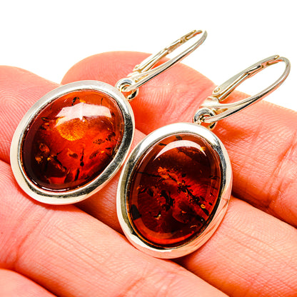 Oval amber earrings with 925 sterling silver frames and lever backs