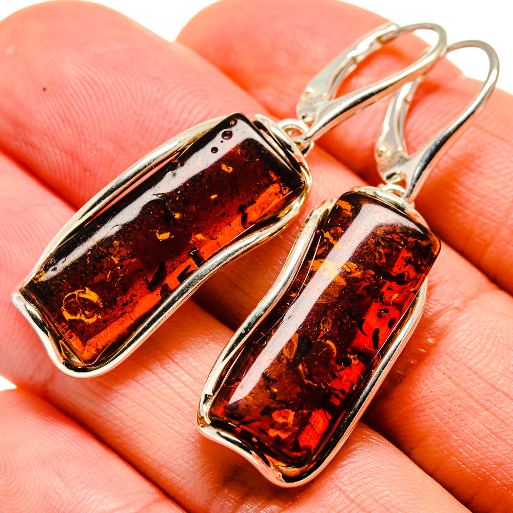 Rectangular amber drop earrings with speckled inserts in sterling silver frames