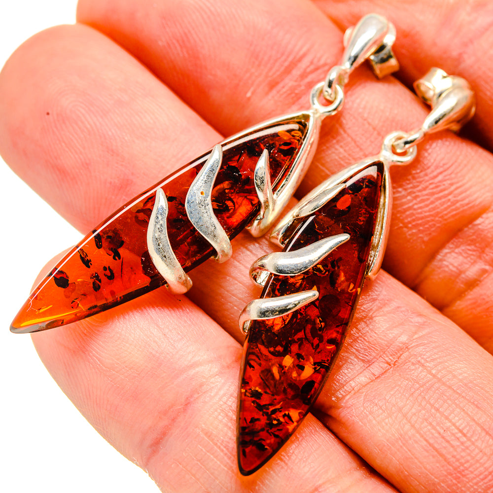 Baltic amber drop earrings in 925 sterling silver, orange teardrops with silver claw settings