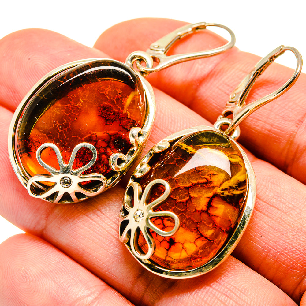 Amber cabochon drop earrings with floral cutout frames, 925 sterling silver hooks