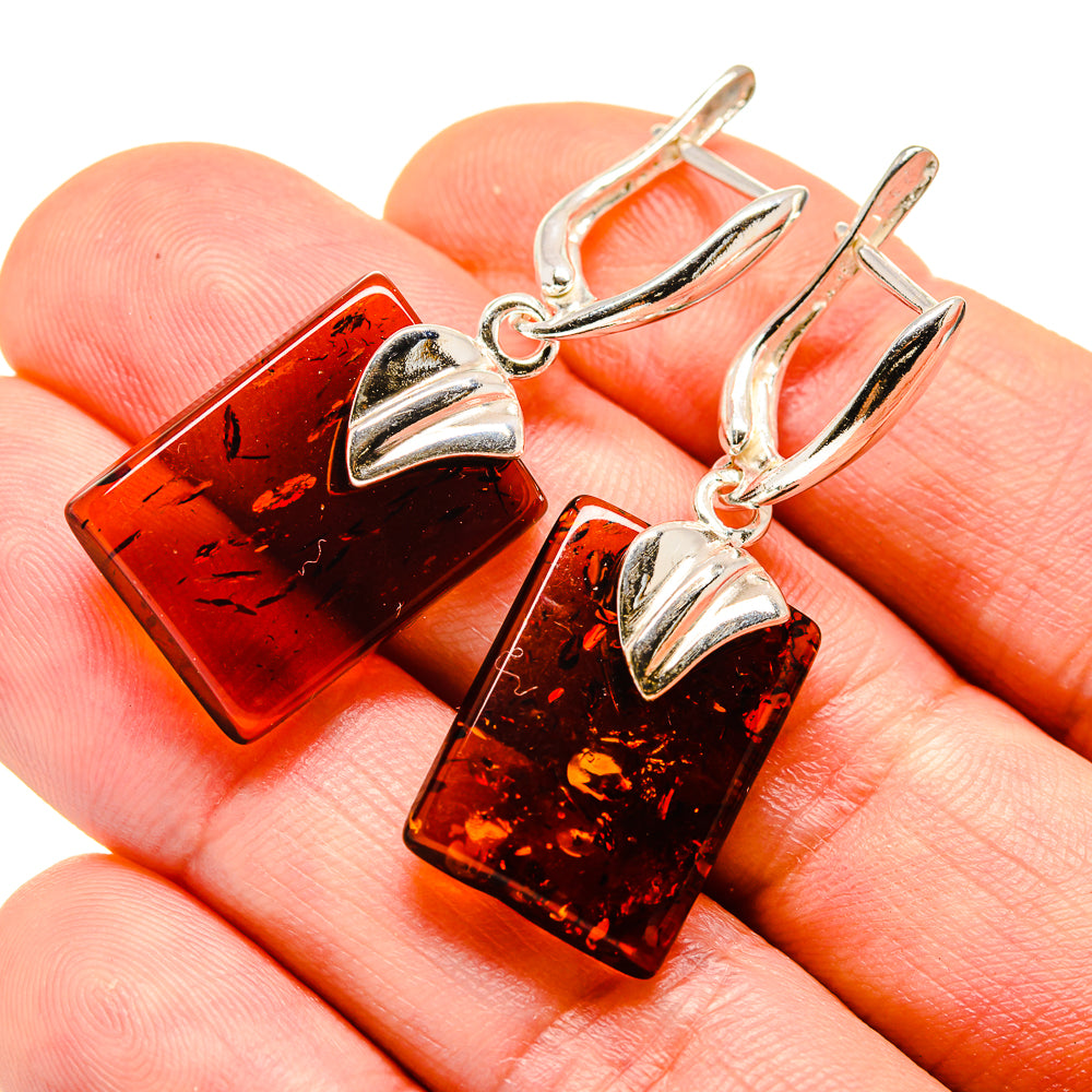 Baltic amber earrings with rectangular orange stones and silver hoop settings