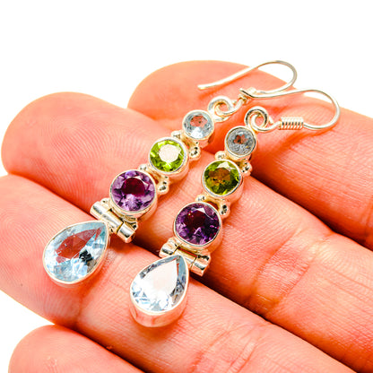 Multicolor gemstone drop earrings with round purple and green stones and blue teardrops