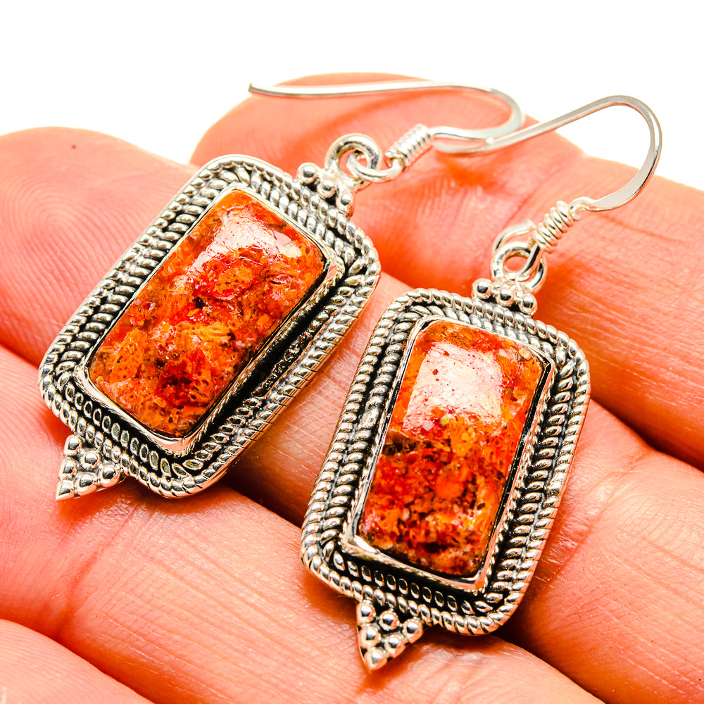 Sterling silver coral-style earrings with rectangular orange stone, ornate bezel