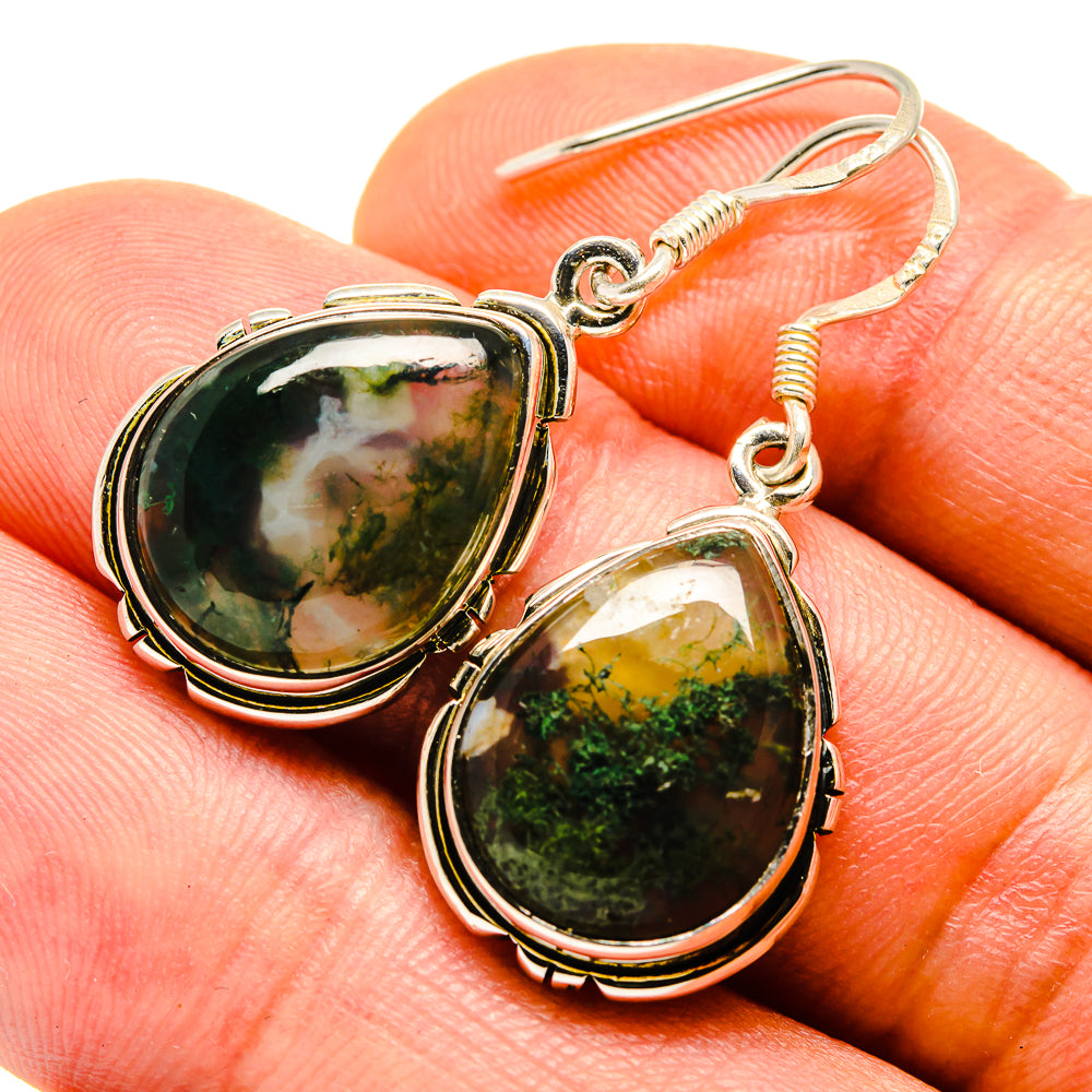 Moss agate oval cabochon earrings on sterling silver hooks, close-up
