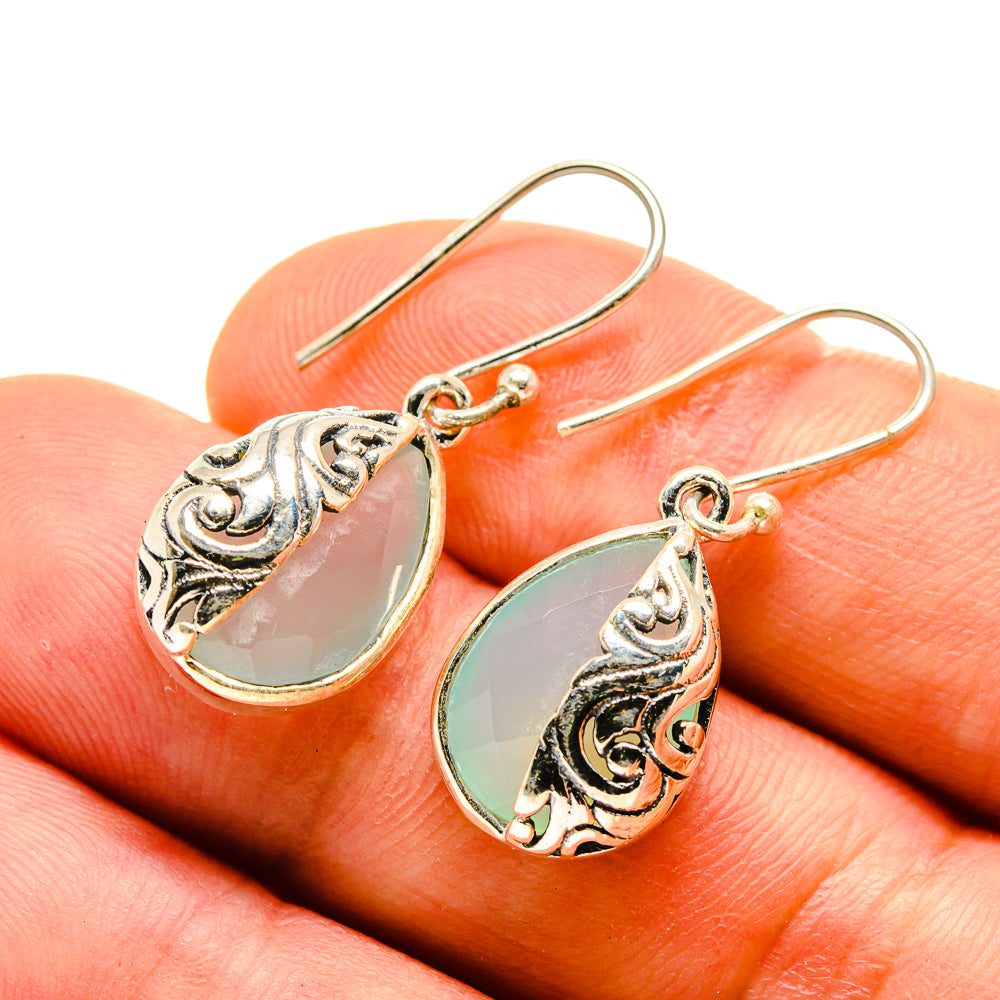 Aqua chalcedony teardrop earrings, ornate 925 sterling silver hooks, close-up