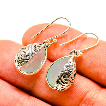 Aqua chalcedony teardrop earrings, ornate 925 sterling silver hooks, close-up