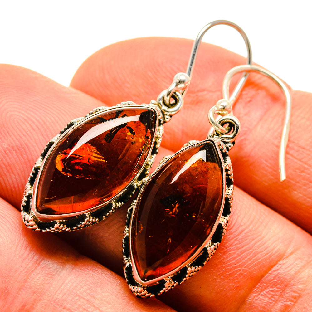 Baltic amber teardrop earrings with dark honey amber stones and silver rope-edge bezels
