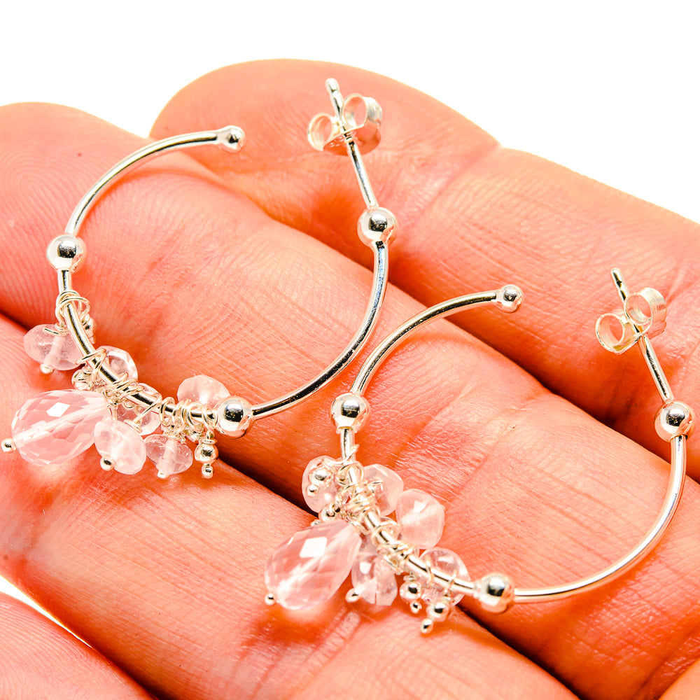 Rose quartz gemstone cluster hoop earrings on silver loops, close-up
