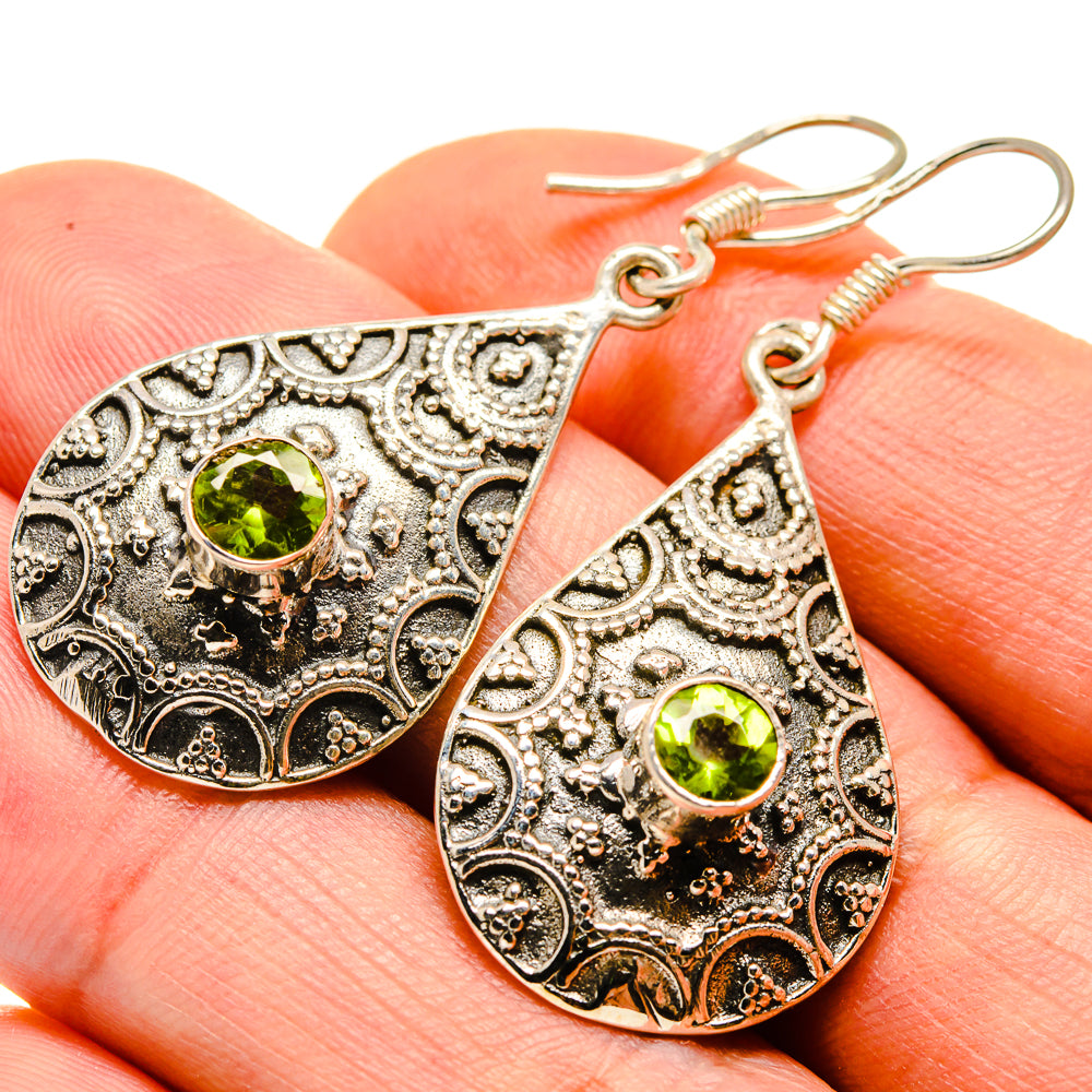 Peridot teardrop drop earrings with round green gemstone and engraved filigree