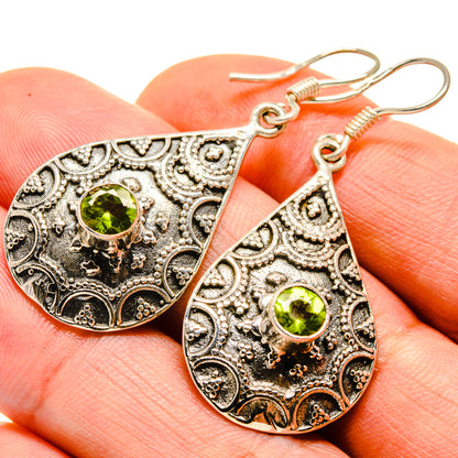 Peridot teardrop drop earrings with round green gemstone and engraved filigree