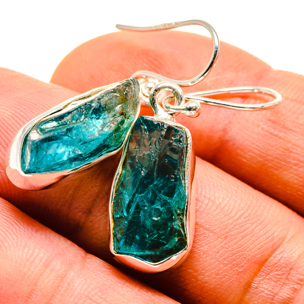Sterling silver fluorite earrings with blue-green teardrop stones and hook backs